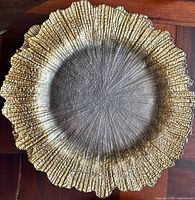 Gold textured glass charger close-up