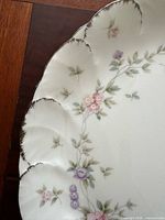Close detail of floral pattern and platinum rim