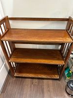 Front view showing full bookcase with three shelves