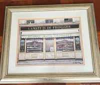 Full view of framed Andre Renoux print with mats and frame visible