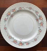 Close-up of Georgian dinner plate showing floral pattern and gold rim
