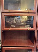 Full view upper sections showing glass doors and brass knobs