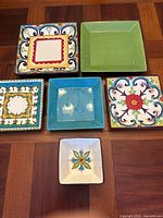 group of square plates showing different patterns and colours