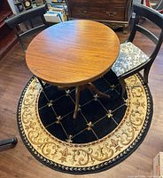 Table, chairs, rug full view