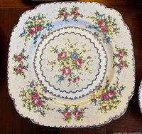 large square dinner plate showing Petit Point pattern