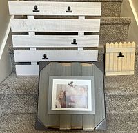 All three wooden clip frames on carpeted stairs