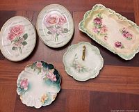 Group view of all five decorative ceramic pieces on wood surface