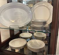 Full set in cabinet showing platter and stacked plates/bowls