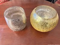 Gold crackle glass rose bowl and silver mercury glass bowl side by side