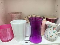 Group of assorted vases and pitcher on shelf