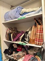 shelves with handbags, bathrobe, socks and gloves visible