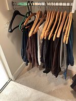 Row of women’s pants and skirts on hangers