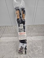 Full view of sealed package showing both poles and accessories