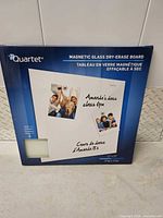 Front of sealed box showing Quartet magnetic glass dry-erase board image and size