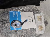 Bubble-wrapped G2RISE SN01 full face snorkel mask showing product tag and mesh bag