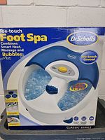 Front of retail box showing Dr. Scholl's Toe-Touch Foot Spa with features highlighted