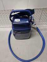 Front view of Polar Care Cube unit with hose attached