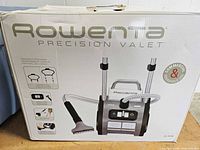 Retail box showing Rowenta Precision Valet garment steamer image and specifications