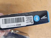 Side label showing brand, barcode and product info