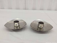 Top view of both candle holders displaying dish shape and candle sockets