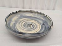 Top angled view of ceramic bowl showing swirl design