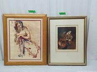 Both framed prints side by side