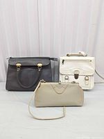 Group shot of three bags: dark brown handbag, white satchel, beige clutch