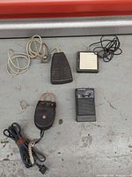 All four items laid out: demagnetizer, Whisper 2000 box, wedge footswitch, square footswitch