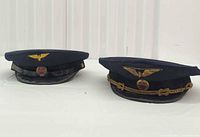 Both Bulgarian uniform caps side by side showing overall style, color and badges