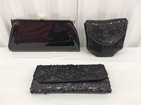 overview of all three black evening bags