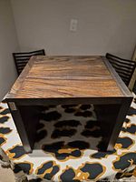 Top view showing wood grain and square shape