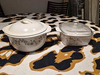 Both covered casserole dishes side by side on tabletop