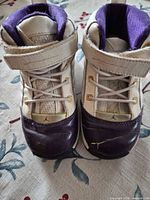 Front view showing laces, Velcro strap, toe scuffs
