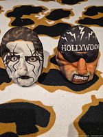 Front view of both plush stress balls showing character faces and details