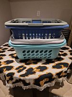 Stacked view of three baskets showing teal, blue and gray units