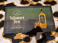 Full view of Tullamore Dew bar mat on patterned surface