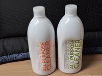Front view of two sealed all-purpose cleaner bottles