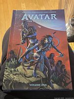 Front cover showing title, artwork, and Volume One designation