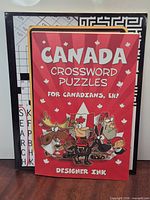 Front covers of three puzzle/activity books