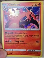 Front of Charizard Dragon Majesty holo card in sleeve