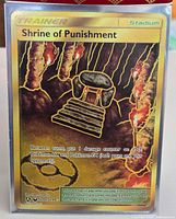 Front of gold foil Shrine of Punishment card in sleeve showing secret rare numbering