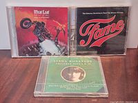 Front view of all three sealed CDs