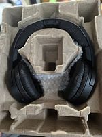 Headphones in molded paper tray with bubble wrap