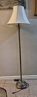 Full view of floor lamp with shade