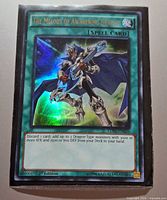 Front of The Melody of Awakening Dragon card in sleeve showing holographic foil and card details.