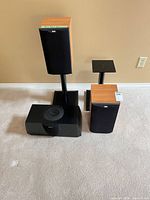 Front view of both B&W speakers on stands and Pioneer center speaker
