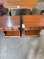 Pair of cherry nightstands front view showing tops and overall style