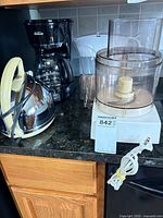 Group shot of all items: food processor, kettle, coffee maker, Brita jug