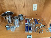 Full lot showing barware pieces and array of souvenir spoons