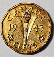 Reverse showing large V with torch, date 1943, denomination